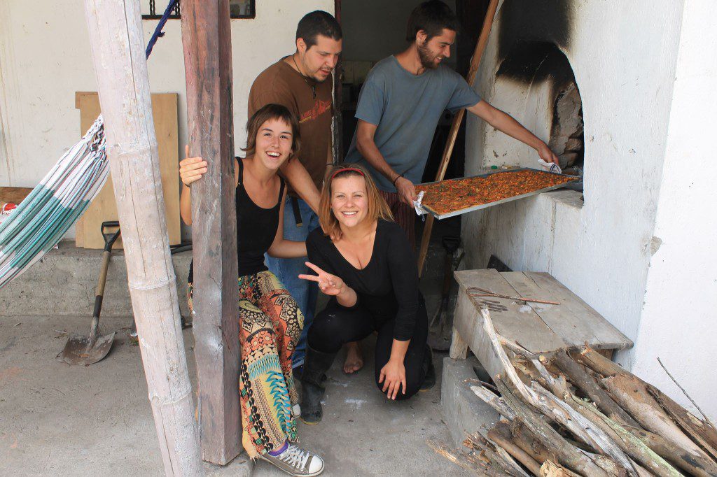Making pizza in a brick-oven at Killa Wasi Hostel